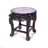 A CHINESE HARDWOOD MARBLE INSET SIDE TABLE The shaped circular top with a pink marble inset surface,