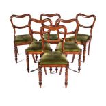 A SET OF SIX WILLIAM IV ROSEWOOD SIDE CHAIRS Each open bustle-back with a carved mid rail, drop in