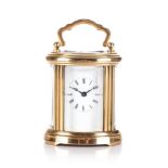 A BRASS CARRIAGE CLOCK The rectangular white dial with Roman numeral hour markers, calibrated