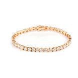A DIAMOND TENNIS BRACELET Claw-set with forty round brilliant-cut diamonds weighing approximately