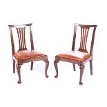 A PAIR OF GEORGE III MAHOGANY SIDE CHAIRS Each curved top rail above a pierced splat, drop in