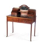 AN EDWARDIAN BUREAU-DE-DAME The moulded rectangular top with a gilt-tooled leather inset writing