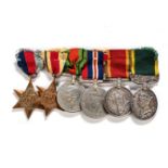 A GROUP OF WWII MEDALS Comprising: a 1939-1945 Star, an Africa Star, a Defence Medal, a 1939-1945