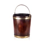 A TEAK AND BRASS-BOUND PEAT BUCKET Tapering sides beneath a bail handle42cm high excluding handle,