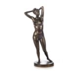 A CONTINENTAL BRONZE FIGURE OF A FEMALE NUDE The standing figure with arms raised and clasped behind