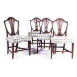A SET OF SIX HEPPLEWHITE STYLE MAHOGANY SIDE CHAIRS, 19TH CENTURY Each shield back with a pierced