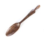 TSONGA SPOON WITH HEAD, SOUTH AFRICA Carved wooden spoon with a human head at the top of the handle.