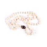 A PEARL NECKLACE The single strand composed of seventy-one pearls measuring approximately 8mm in