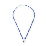 A SAPPHIRE AND DIAMOND ENHANCER PENDANT AND SAPPHIRE BEAD NECKLACE The pendant centred with a