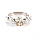 A DIAMOND RING Claw-set to the centre with a round brilliant-cut diamond weighing approximately 1,