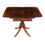 A REGENCY MAHOGANY AND ROSEWOOD PEMBROKE TABLE The hinged rectangular crossbanded top above a frieze