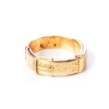 A GOLD RING Designed as a buckled belt, acid tested as 18ct, distress, ring size N1/2
