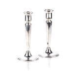 A PAIR OF SILVER CANDLESTICKS, TIFFANY AND COMPANY Each octagonal tapering stem on a reeded circular