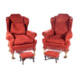 A PAIR OF UPHOLSTERED WINGBACK ARMCHAIRS, 19TH CENTURY Each padded back and sides above a loose seat