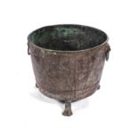 A COPPER PLANTER, 19TH CENTURY The tapering cylindrical body applied with two lion-head loop