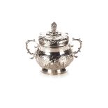 A SILVER PORRINGER AND COVER The cover marked W M, London, 1662, embossed with buds and flowers, bud