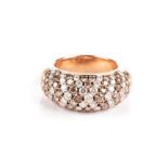 A DIAMOND DRESS RING Of bombe design, with brown and near-colourless round brilliant-cut diamonds,