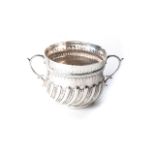 A SILVER PORRINGER, MAPPIN & WEBB, LONDON The bulbous body chased with various lines, on a