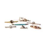 A COLLECTION OF GOLD BROOCHES 7 in total, various sizes and lengths, set with turquoise, garnets,