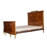 A SATINWOOD, INLAID AND GILT-METAL MOUNTED BED The plain head and foot board on turned tapering