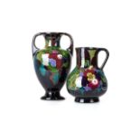 TWO HAND PAINTED GOUDA CERAMICS Comprising: an urn form vase, high luster black ground with abstract