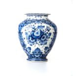 A BLUE AND WHITE 'REGINA' DELFT BLAUW VASE With floral and leaf motif, painted signature and factory