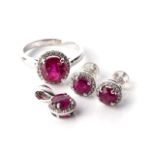 A SUITE OF RUBY AND DIAMOND JEWELLERY The ring claw-set to the centre with an oval ruby, weighing