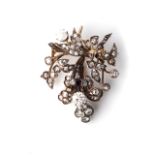 A DIAMOND BROOCH Claw-set to the sides with 2 rose-cut diamonds with a combined weight of
