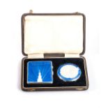 A PAIR OF SILVER ENAMELLED COMPACTS IN ORIGINAL VELVET BOX, BIRMINGHAM, 1946 92g (2)