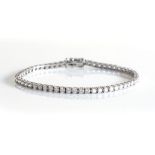 A BROWNS DIAMOND TENNIS BRACELET Claw-set with round brilliant-cut diamonds weighing 5,31cts, colour