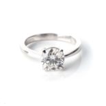 A DIAMOND SOLITAIRE RING Claw-set to the centre with a round, brilliant-cut diamond, weighing 1,