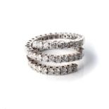 A DIAMOND DRESS RING Claw-set as a flexible, articulated spiral row of 28 round, brilliant-cut