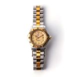 A LADY'S TAG HEUER WRISTWATCH Reference no. WK1321 with circular gold dial, 15mm wide with baton