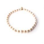 A SOUTH SEA CULTURED PEARL AND Alternating cultured pearls with diamond-encrusted spacers in 14ct