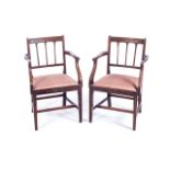 A PAIR OF MAHOGANY SHERATON-STYLE ARMCHAIRS With carved square backs and reeded splats, arms run