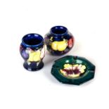 TWO MOORCROFT ‘WINTER’ PATTERN VASES Both on a blue ground, and a Moorcroft 'Hibiscus' pattern