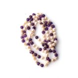 A STRAND OF AMETHYST AND FRESHWATER The alternating amethyst and pearls with gold spacers, 80cm in