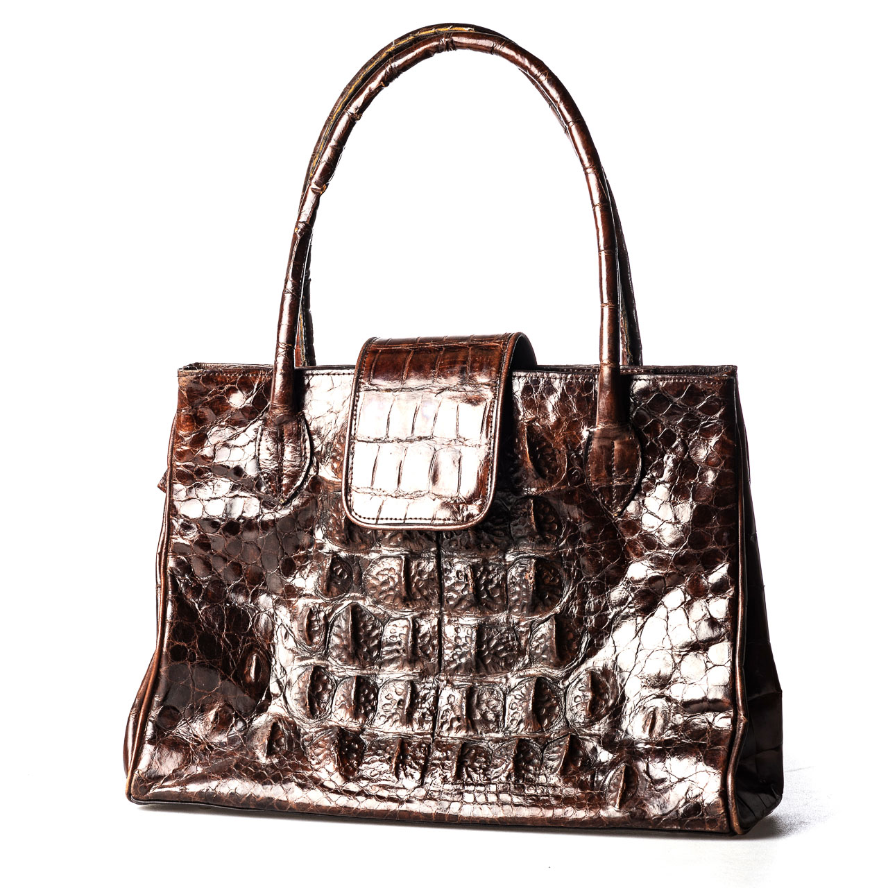 A LEATHER HANDBAG Crocodile, four internal compartments, secured by a zip25cm high, 40cm wide