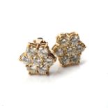 A PAIR OF DIAMOND EARRINGS Claw-set with 14 round, brilliant-cut diamonds, weighing 3,50cts,