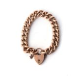 A GOLD BRACELET The 9ct rose gold curb link bracelet, with padlock, 19cm in length, secured by a