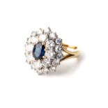 A DIAMOND AND SAPPHIRE RING Claw-set to the centre with an oval sapphire weighing approximately 1,