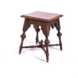 AN OAK TABLE, LATE 18TH CENTURY With a panelled square top above a carved apron with roundels,