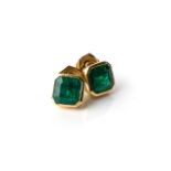 A PAIR OF EMERALD EARRINGS Bezel-set to the centre, box design with a pair of matching emerald-cut