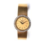 A LADY’S CHOPARD WRISTWATCH The circular gold dial, 20mm wide with baton hour markers, diamond-