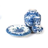 AN ASSORTMENT OF BLUE AND WHITE DUTCH DELFTWARE All similarly decorated with flowers and foliage,