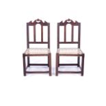 A PAIR OF CAPE STINKWOOD 'TULBAGH' CHAIRS With high back and crest shaped rail, riempie seats,