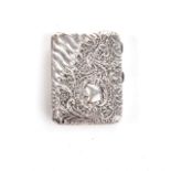 A SILVER CIGARETTE CASE RING The ornately engraved cigarette case with leaves and scrolls, 7cm high,