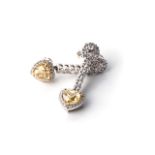 A PAIR OF DIAMOND STUDS Claw-set to the bottom with a pair of heart-shaped diamonds, weighing 2,