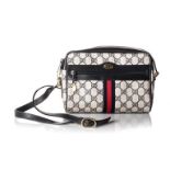 A GUCCI HANDBAG Monogrammed leather black vintage, with zip and removable straps, secured by a