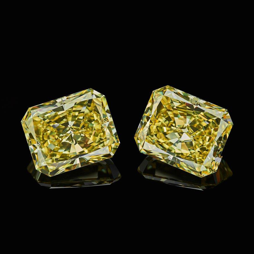 TWO 1.00 CARAT CUT-CORNERED RECTANGULAR FANCY YELLOW DIAMONDS Each accompanied by GIA certificate